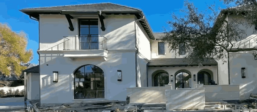 Grogean Residence evening exterior, whole-home lighting at 2700K